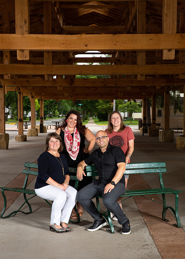 Some of the downtown business owners who are UW-Stout alumni, clockwise from lower right, Micah Maraia, Lisa Anshus Frank, Jennifer Rentmeester and Abbey Schmaling.