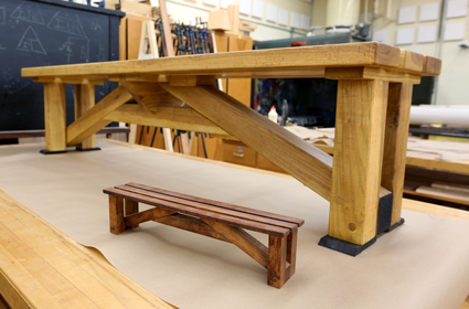 Students first created models, foreground, of bench designs for the disc golf courses in spring 2017 before making seven benches in fall 2017.