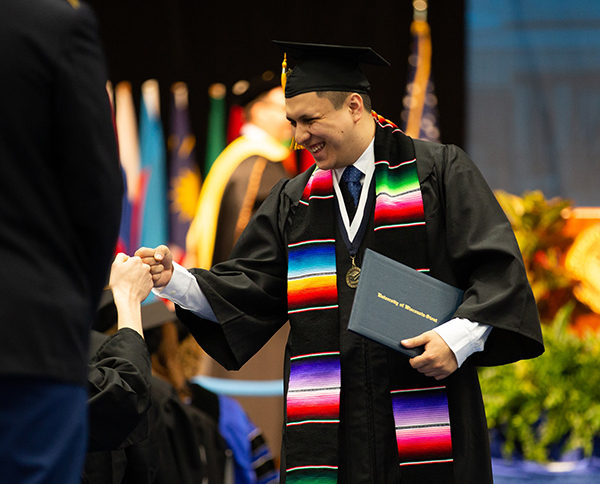 Students celebrate during commencement ceremonies Saturday, May 4.