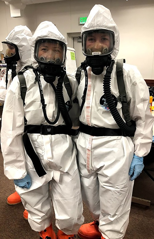 Dickmann, left, and another member of her 128th Air Refueling Wing, wear protective gear during their Wisconsin Air National Guard assignment for the pandemic. She is a medic.