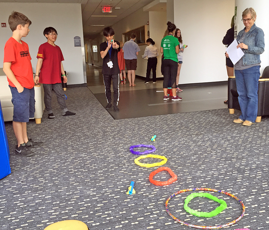 ​   Students at the intercultural leadership portion of the Summer STEAM Experience last year shoot foam rockets after different groups received varying instructions on how to play a game.  ​