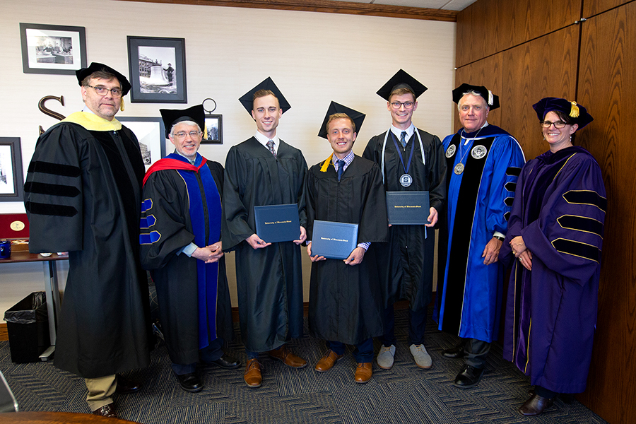 Participating in the student athlete ceremony was Dean Chuck Bomar, at left, Provost Patrick Guilfoile, graduates Jake Houghton, Matt Lancour, Daniel Ressler, Chancellor Bob Meyer and faculty athletic representative Jo Hopp.