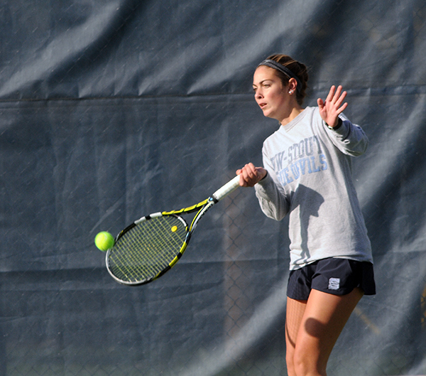 Mariah Kent plays in a UW-Stout tennis match.