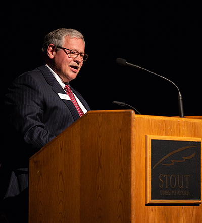 Longtime associate Mark Tyler speaks at the event.