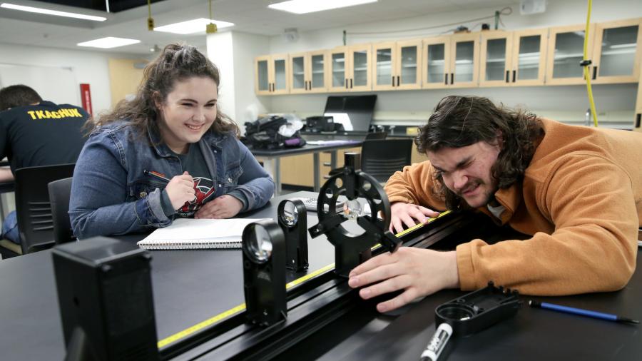 Students in Associate Professor Todd Zimmerman's Applied Optics and Photonics class (PHY 335) are photographed during a lab activity in room 101 Jarvis Hall