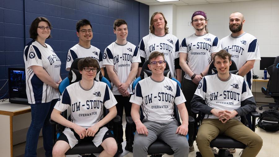 UW-Stout esports players and coaches from the Overwatch team wear new jerseys on a game night in their new Heritage Hall arena.