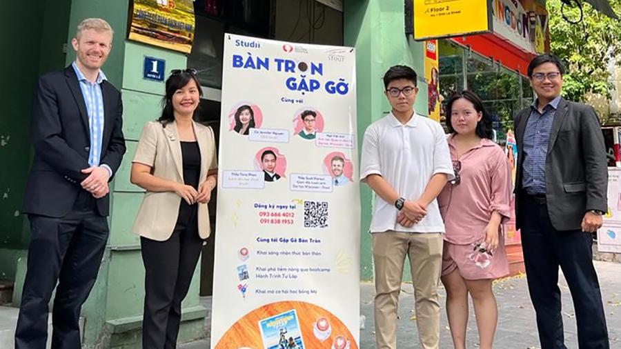 UW-Stout’s Scott Pierson, left, meets in Vietnam in 2022 with two UW-Stout students from the country and representatives of a partner institution for recruitment.