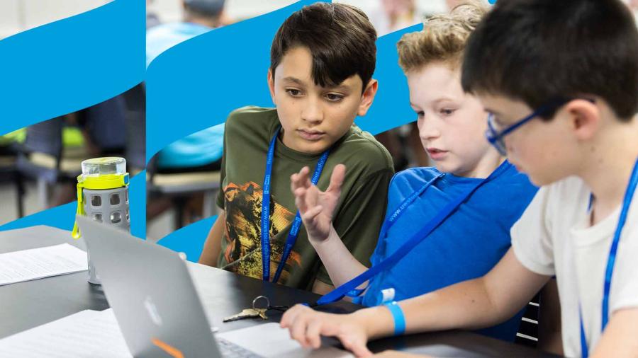 Middle school students react and problem-solve a coding-based challenge.