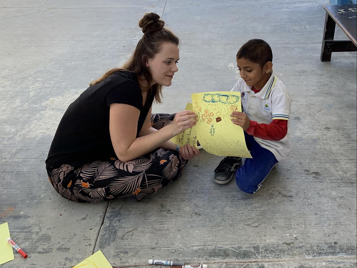 Lindsey Fick, an early childhood education major, works with a child at a school in Cozumel, Mexico, during a recent UW-Stout Winterm course in January.