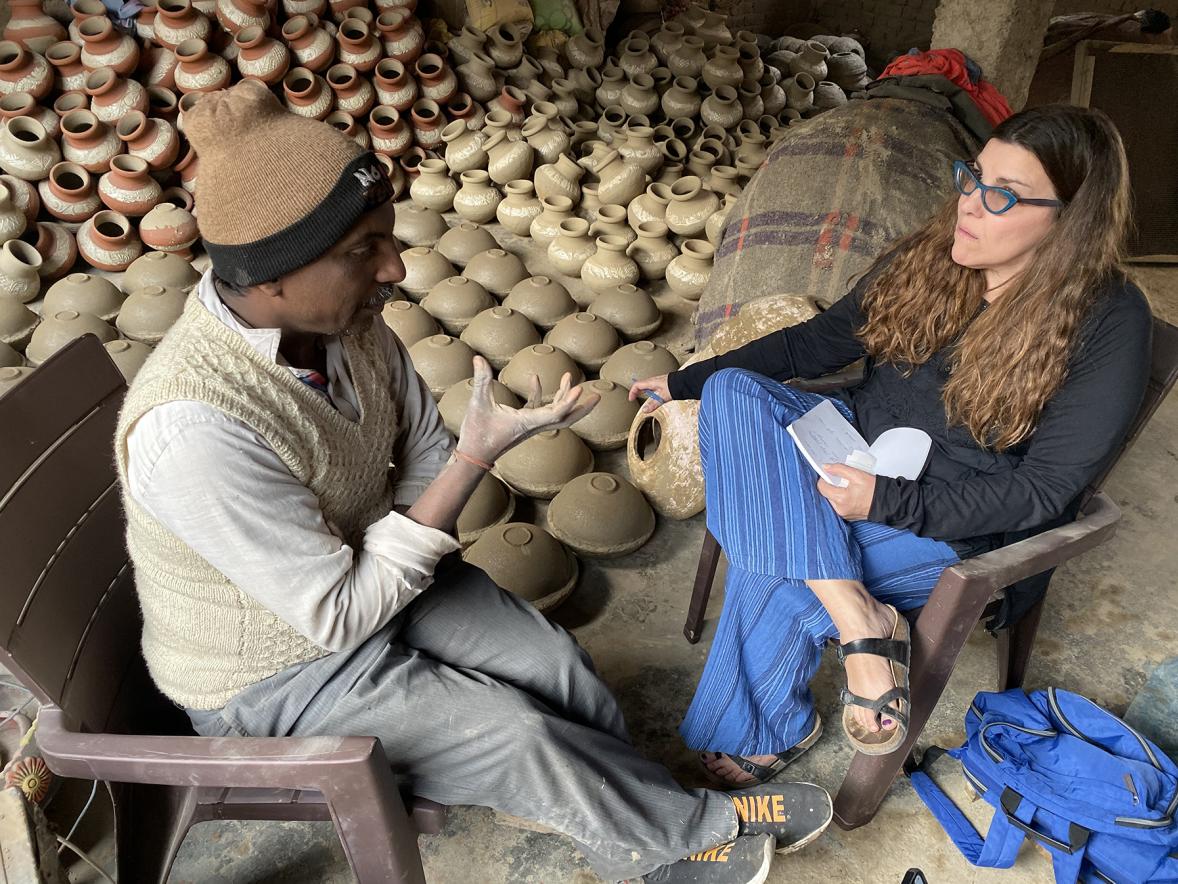 Professor Kate Maury interviews potter Jagmohan when she visited the business run by him and his brother in India. 