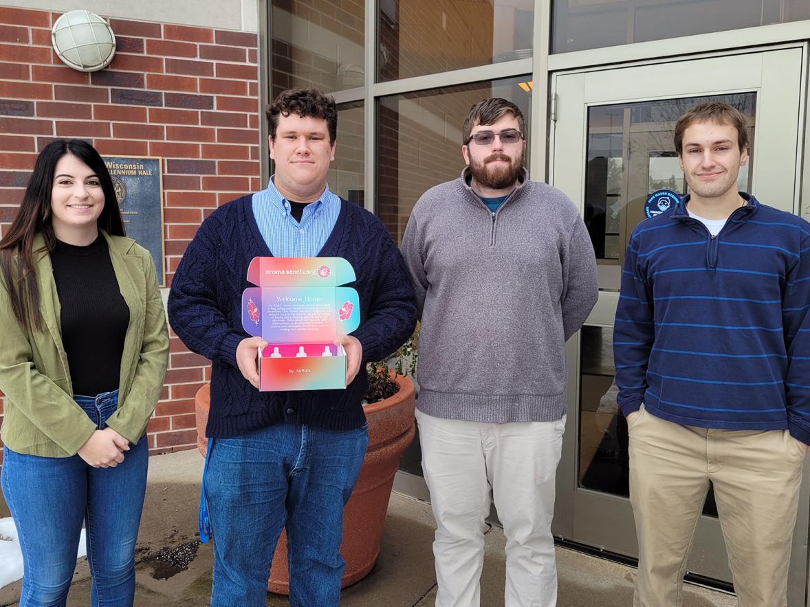 Students Mallorie Mackie, Vaughn Vande Walle, Elliott Nelson and Mike Cops with their packaging sub-brand "Aroma Sanctuary."