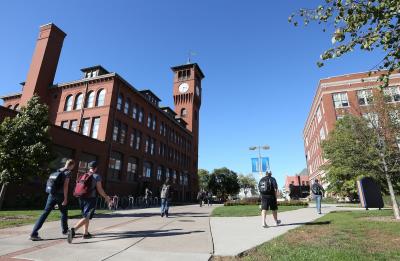 Students walk to classes on campus, near Bowman Hall and Harvey Hall.
