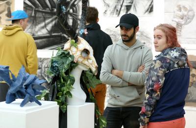 Students in UW-Stout's Furlong Gallery during the NASAD exhibit, April 2018.