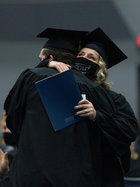 Happy graduates hugged and celebrated before, during and after the ceremonies.
